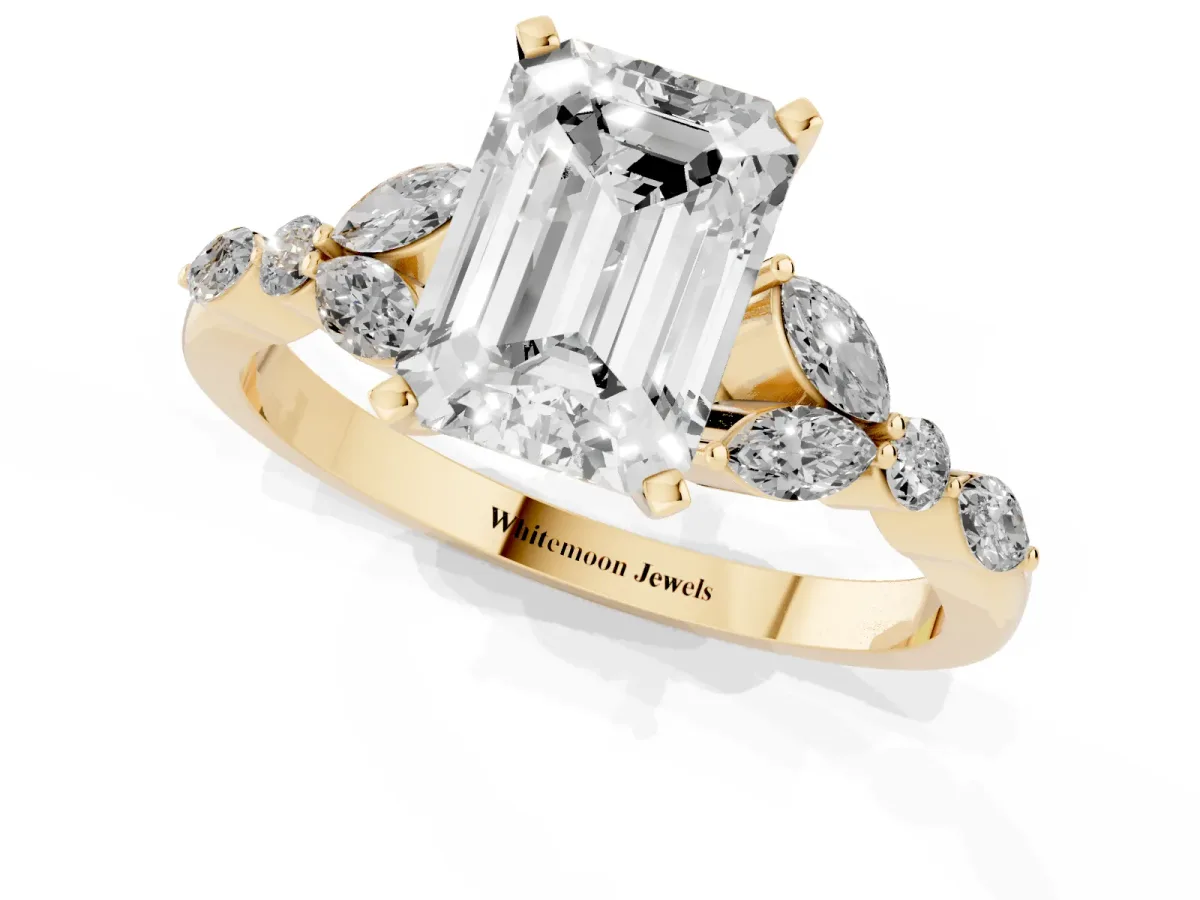 Emerald Cut Diamond Solitaire Ring with Side Stones and Four-Prong Setting Yellow gold
