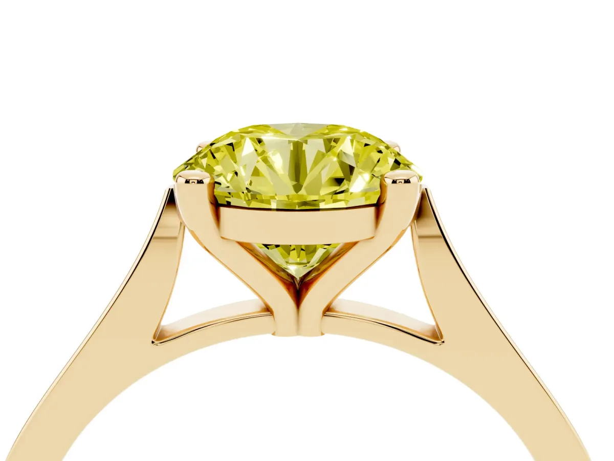 Fancy Yellow Round Cut Solitaire Diamond Ring with Four-Prong Setting and Tapered Band Yellow gold