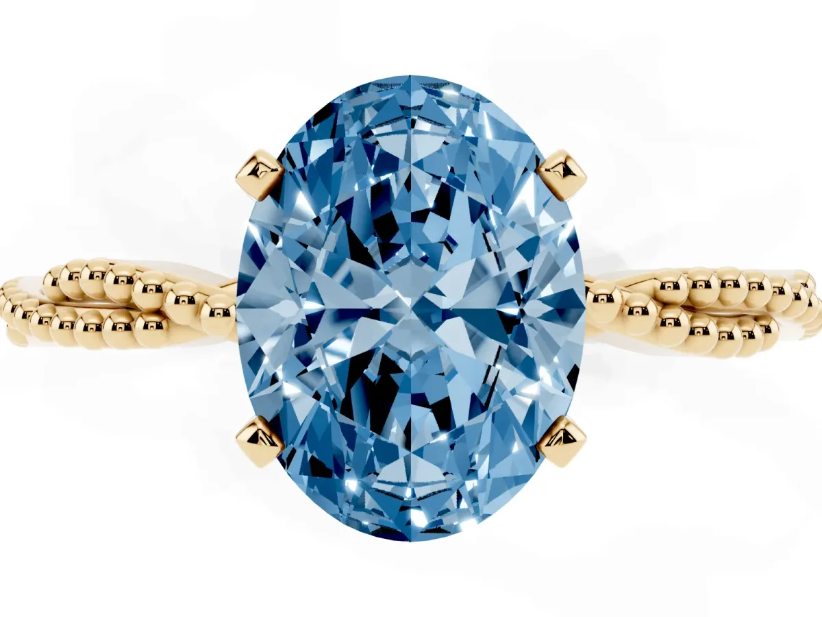 Fancy Blue Oval Cut Solitaire Twisted Band with Bead Prong Setting Yellow gold