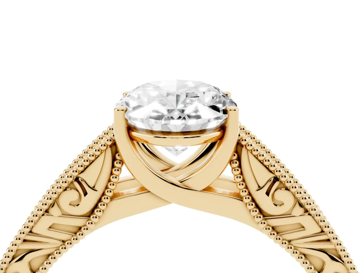 Oval Cut Diamond Solitaire Ring with Engraved Band and Four-Prong Setting Yellow gold