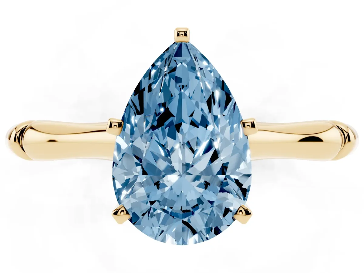 Fancy Blue Pear Cut Solitaire Diamond Ring with Bamboo Band and Four-Prong Setting Yellow gold