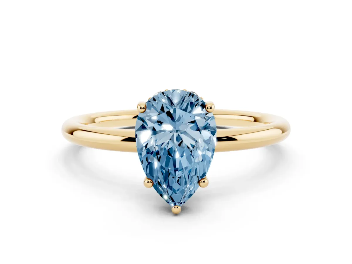 Fancy Blue Pear Cut Solitaire Diamond Ring with a Classic Band and Four-Prong Setting Yellow gold