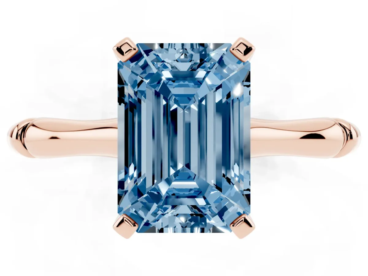 Fancy Blue Emerald Cut Solitaire Diamond Ring with Bamboo Band and Four-Prong Setting Rose gold
