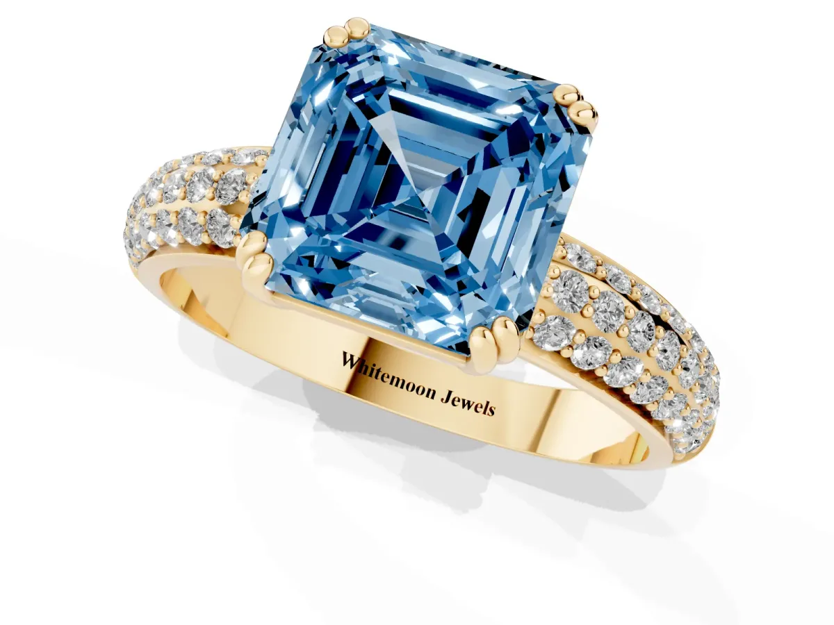 Fancy Blue Asscher Cut Diamond Solitaire Ring with Multi-Row Round Pavé Band and Prong Setting Yellow gold