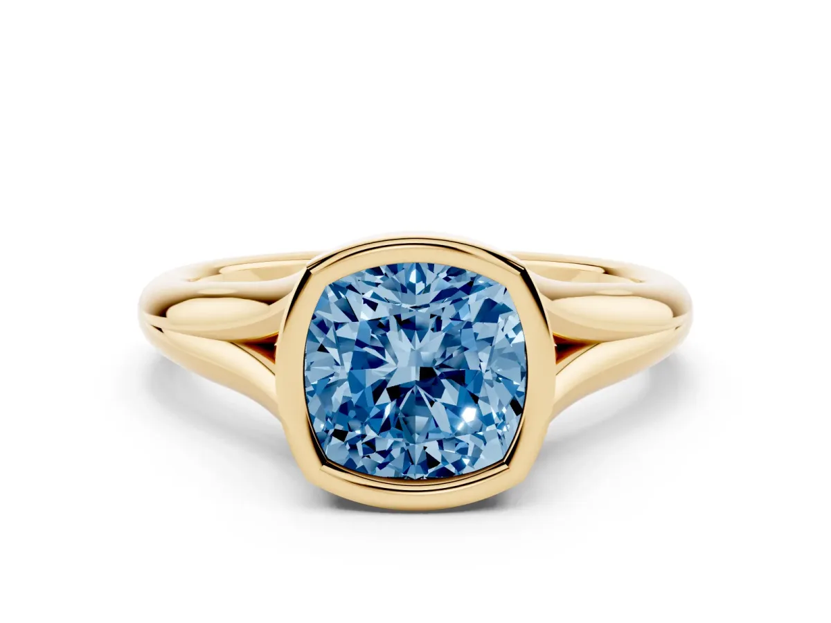 Fancy Blue Bezel Set Cushion Cut Solitaire Diamond Ring with Smooth Band Yellow gold