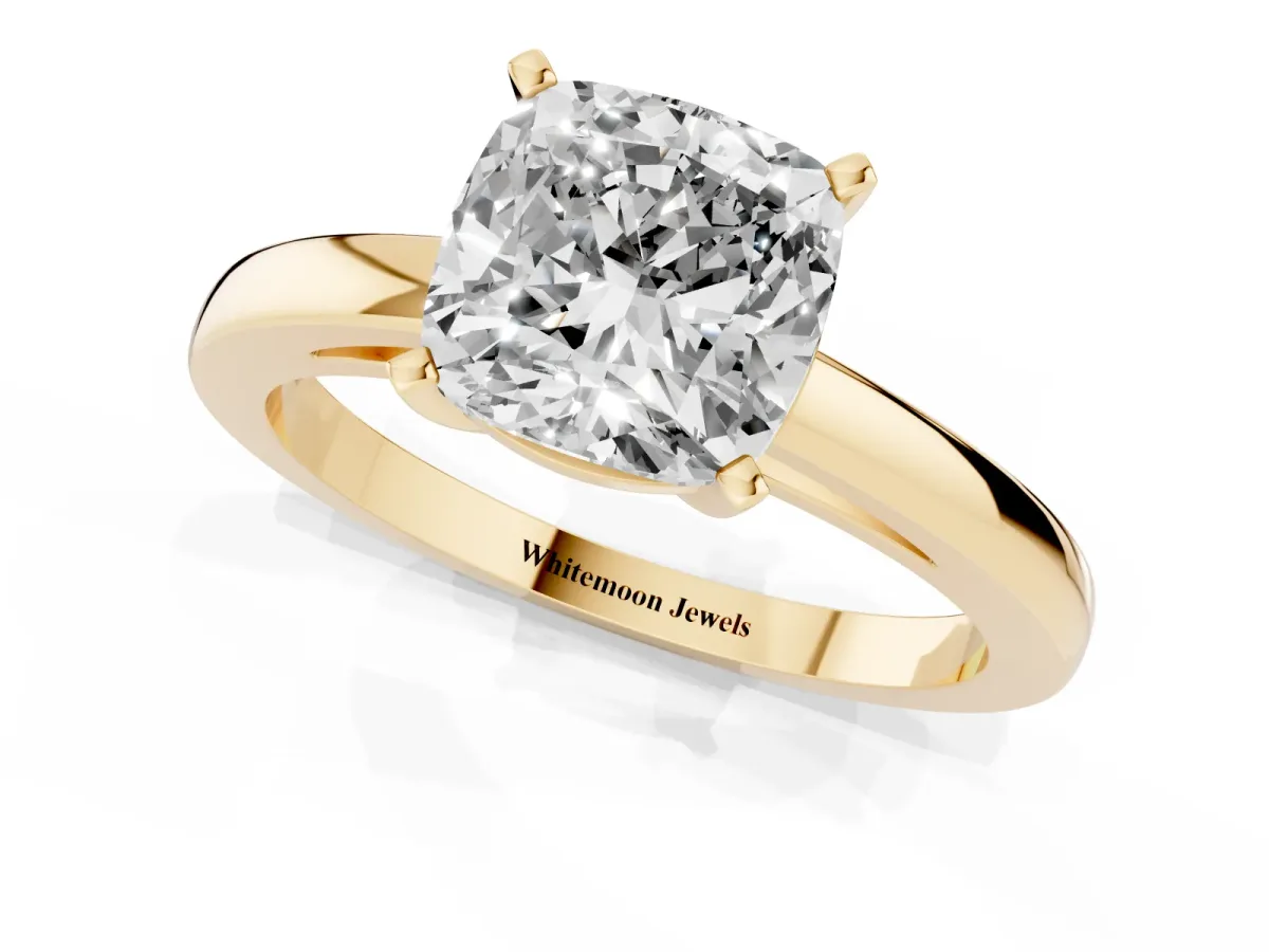 Cushion Cut Solitaire Diamond Engagement Ring with Four-Prong Setting on a Classic Band Yellow gold