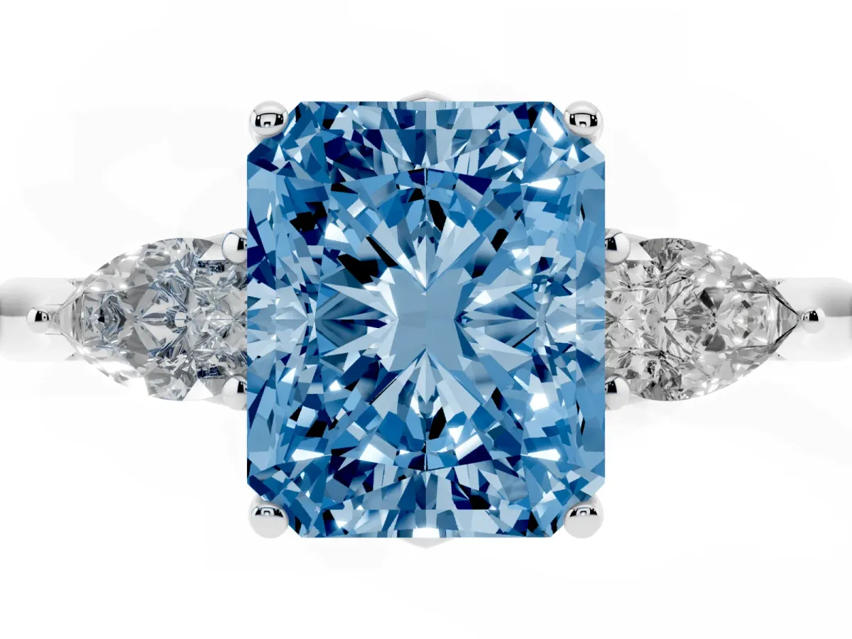 Fancy Blue Radiant Cut Diamond Three-Stone Ring with Pear Side Stones and Prong Setting Platinum
