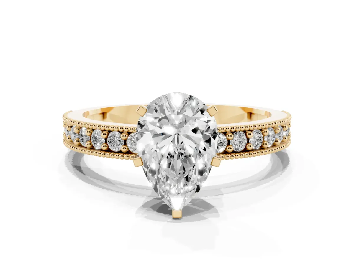 Pear Cut Diamond Milgrain Pavé Engagement Ring with Four-Prong Setting Yellow gold