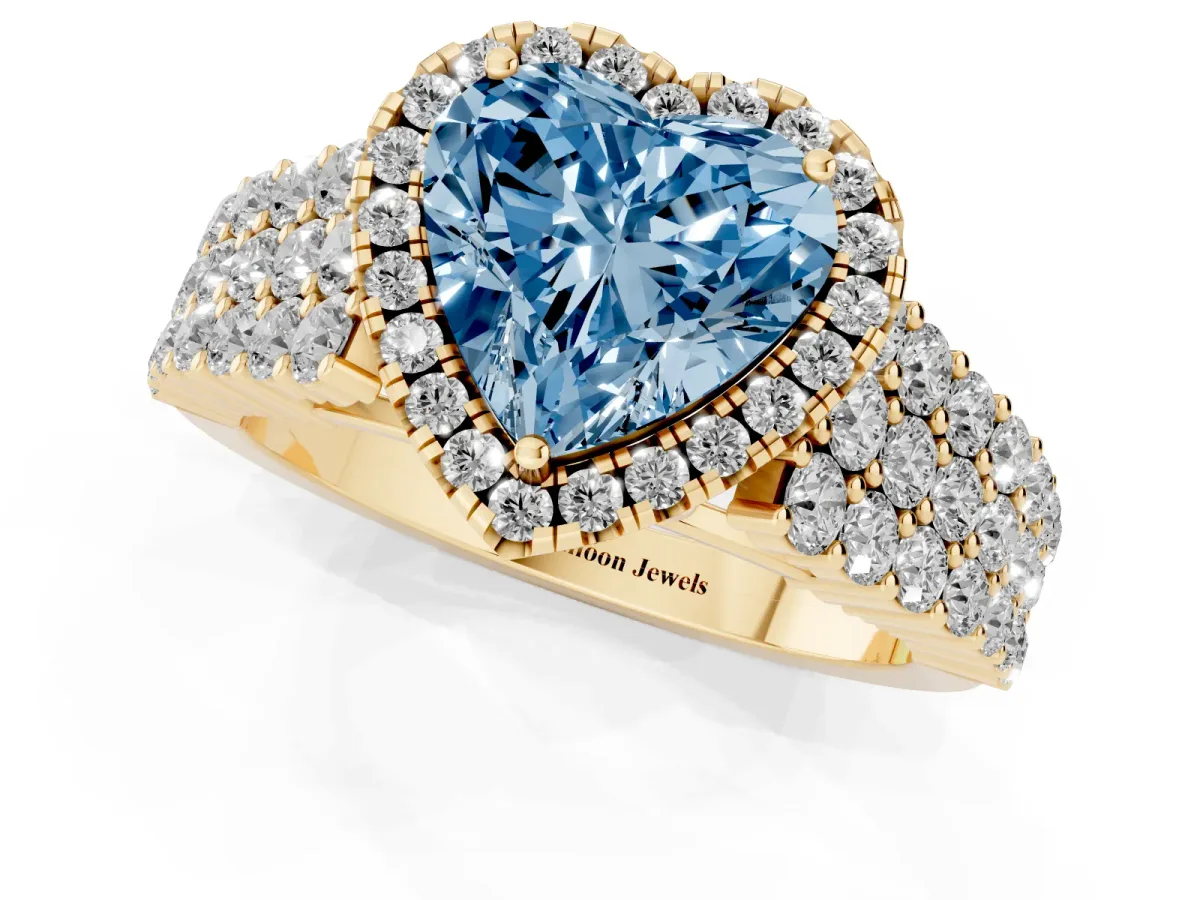 Fancy Blue Heart Cut Diamond Halo Engagement Ring with Triple Row Round Pavé Band and Prong Setting Yellow gold