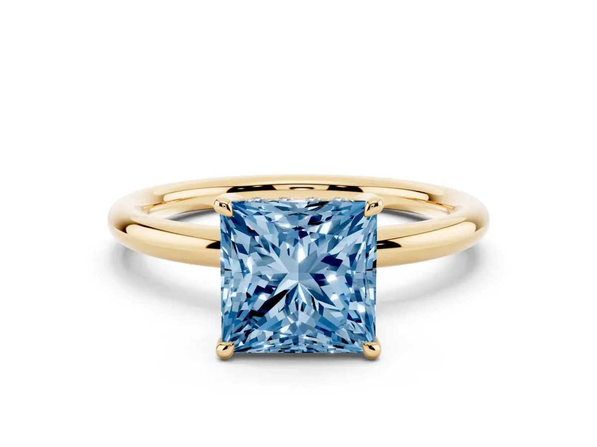 Fancy Blue Princess Cut Diamond Solitaire Ring with Thin Band and Four-Prong Setting Yellow gold