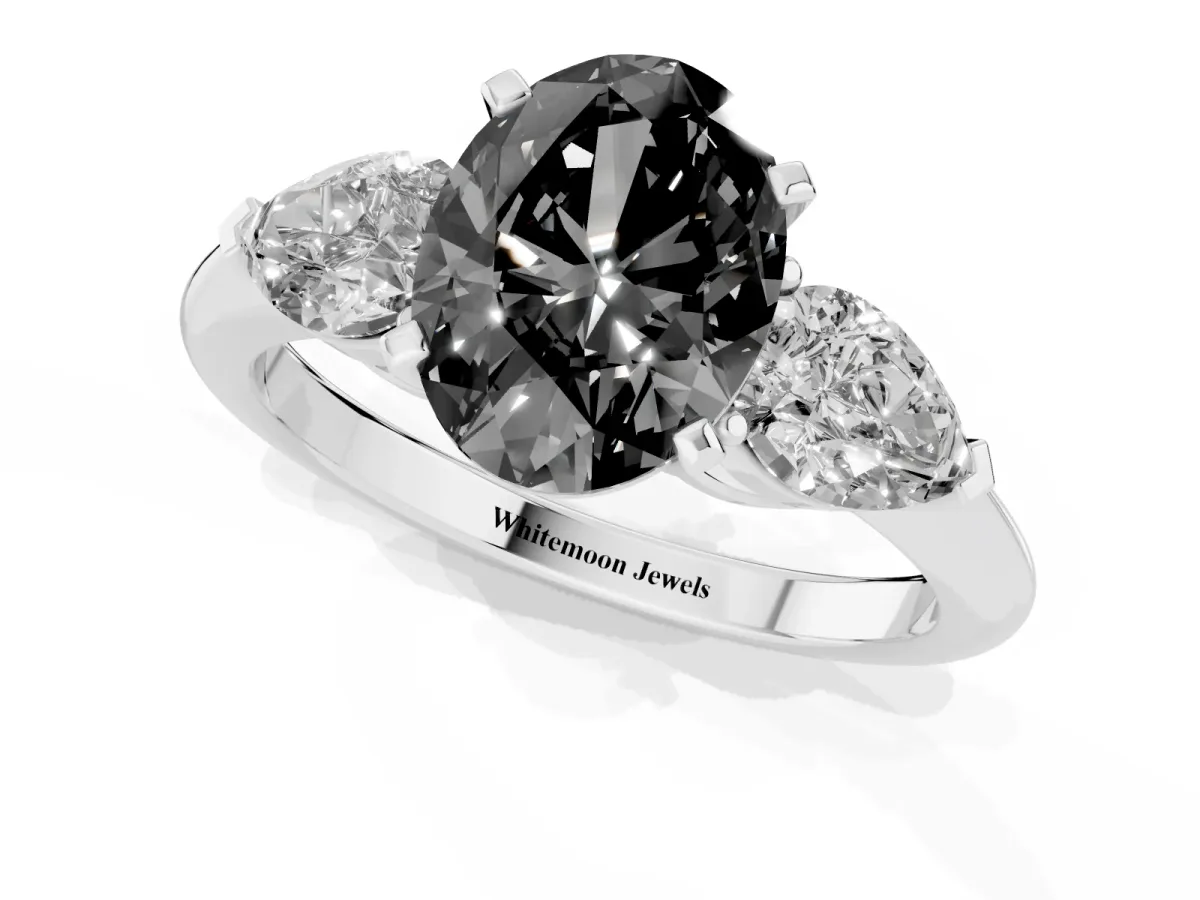 Fancy Black Three-Stone Oval Cut Diamond Ring with Pear Side Stones and Four-Prong Setting Silver