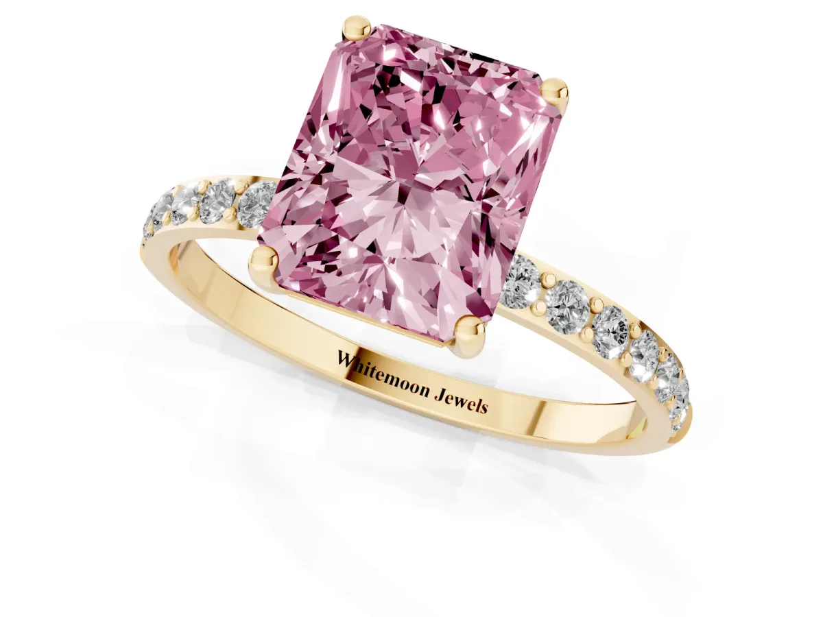 Fancy Pink Radiant Cut Diamond Solitaire Ring with Round Pavé Shoulders and Prong Setting Yellow gold