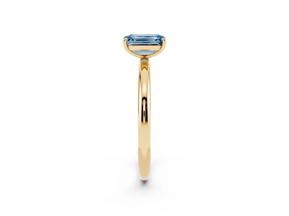 Fancy Blue Emerald Cut Solitaire Diamond Ring with Four-Prong Setting on a Plain Band Yellow gold