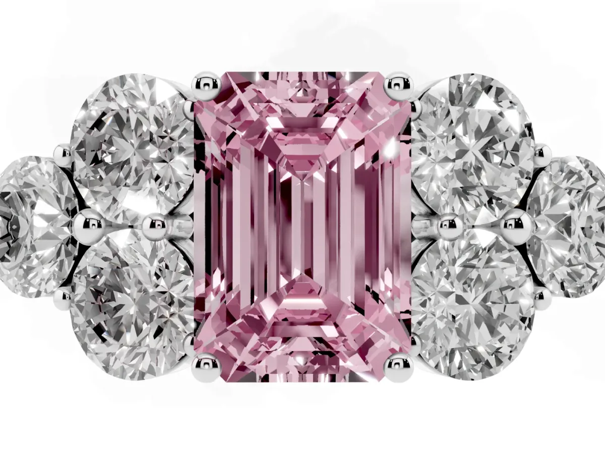 Fancy Pink Emerald Cut Cut Diamond Cluster Ring with Round Accent Stones and Prong Setting on a Classic Band Silver