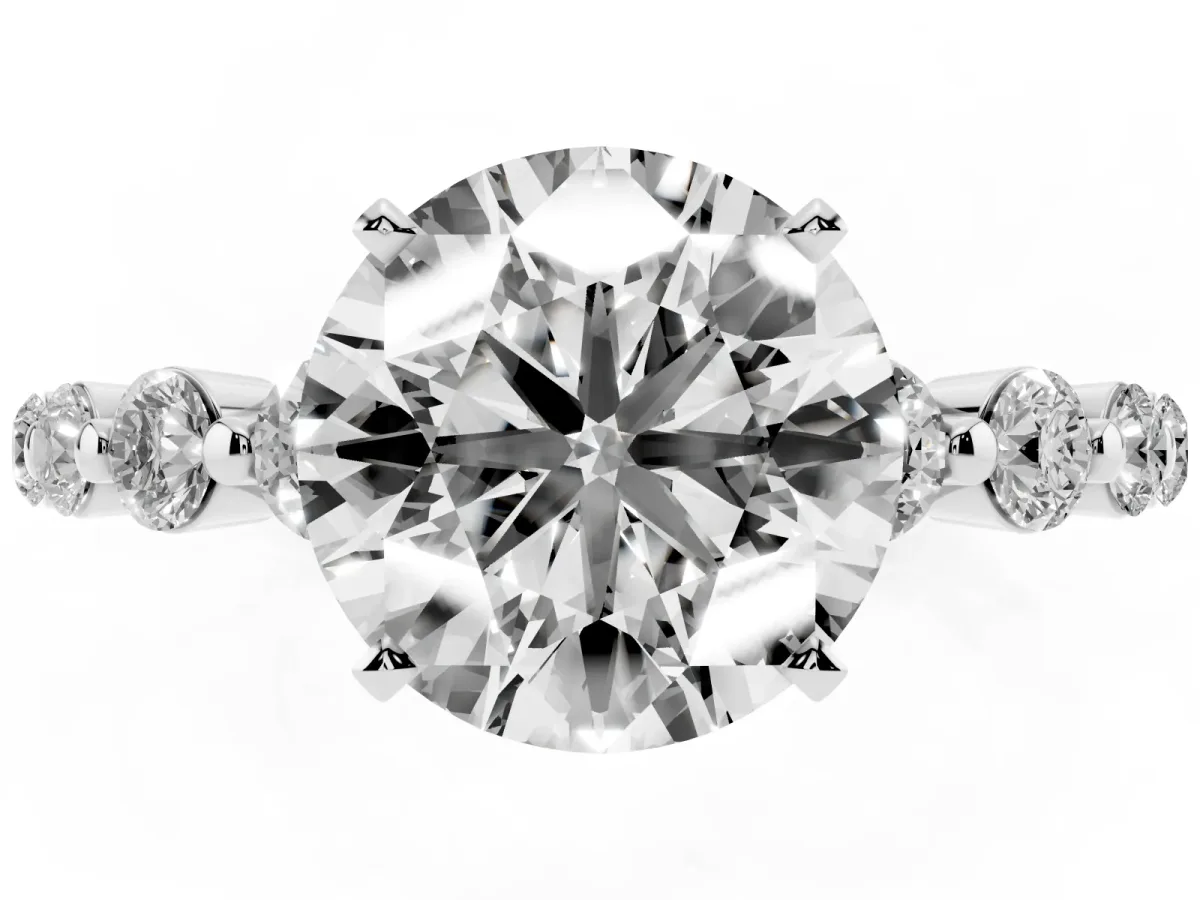 Round Cut Solitaire Diamond Ring with Pave Band and Four-Prong Setting Silver