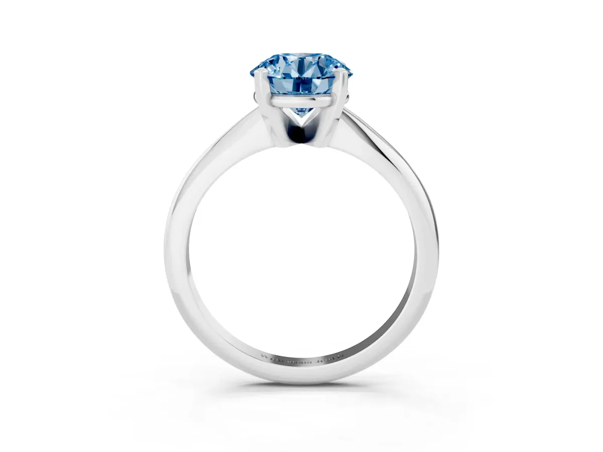 Fancy Blue Round Cut Cut Solitaire Ring with Four-Prong Setting on a Classic Band Silver