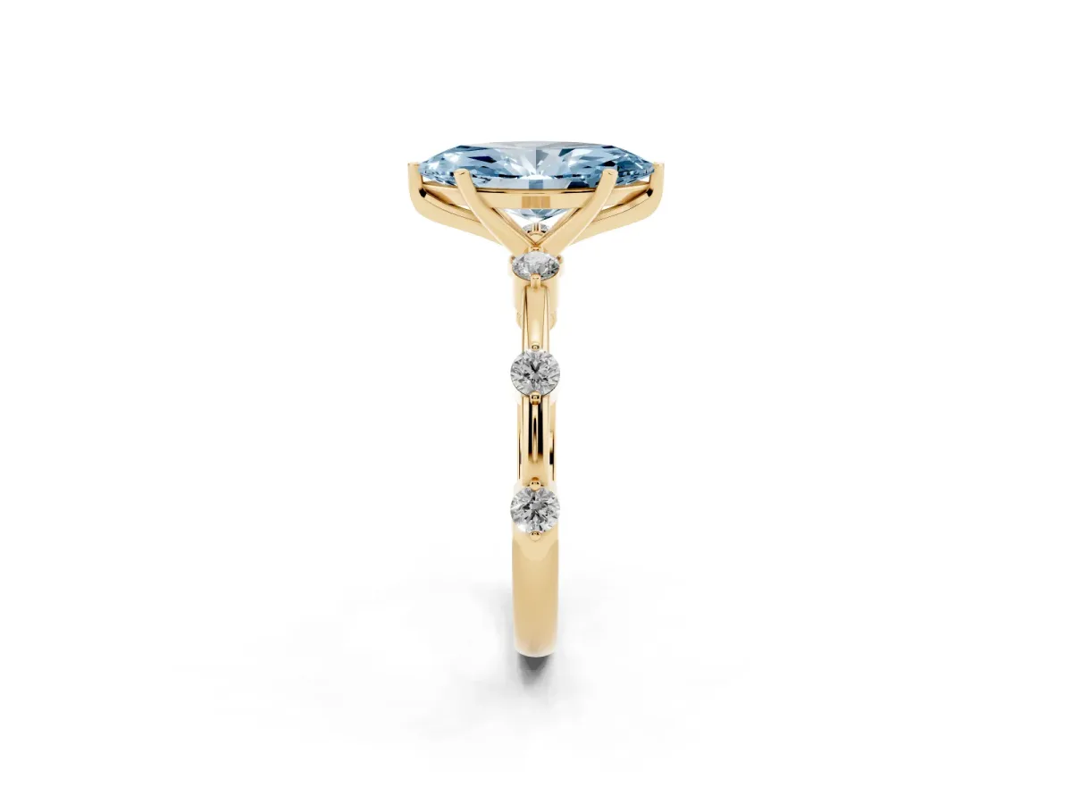 Fancy Blue Marquise Cut Solitaire Diamond Ring with Bezel Set Side Stones and Prong Setting Yellow gold