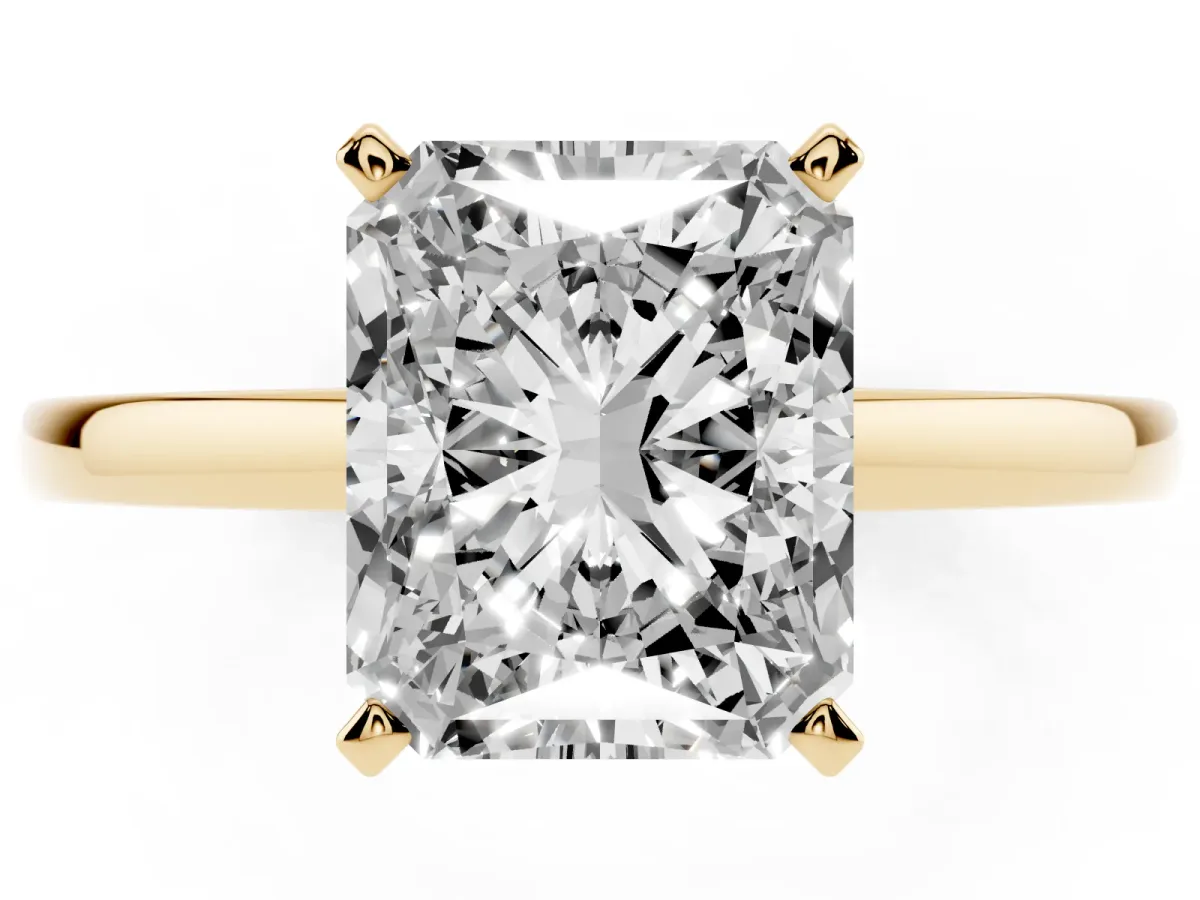 Radiant Cut Solitaire Diamond Engagement Ring with Four-Prong Setting on a Classic Band Yellow gold