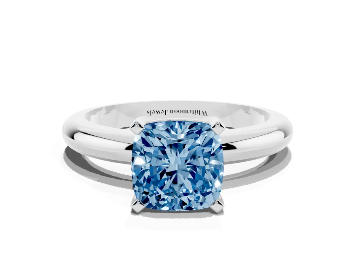 Fancy Blue Cushion Cut Diamond Solitaire Engagement Ring with Round Band and Four-Prong Setting Platinum