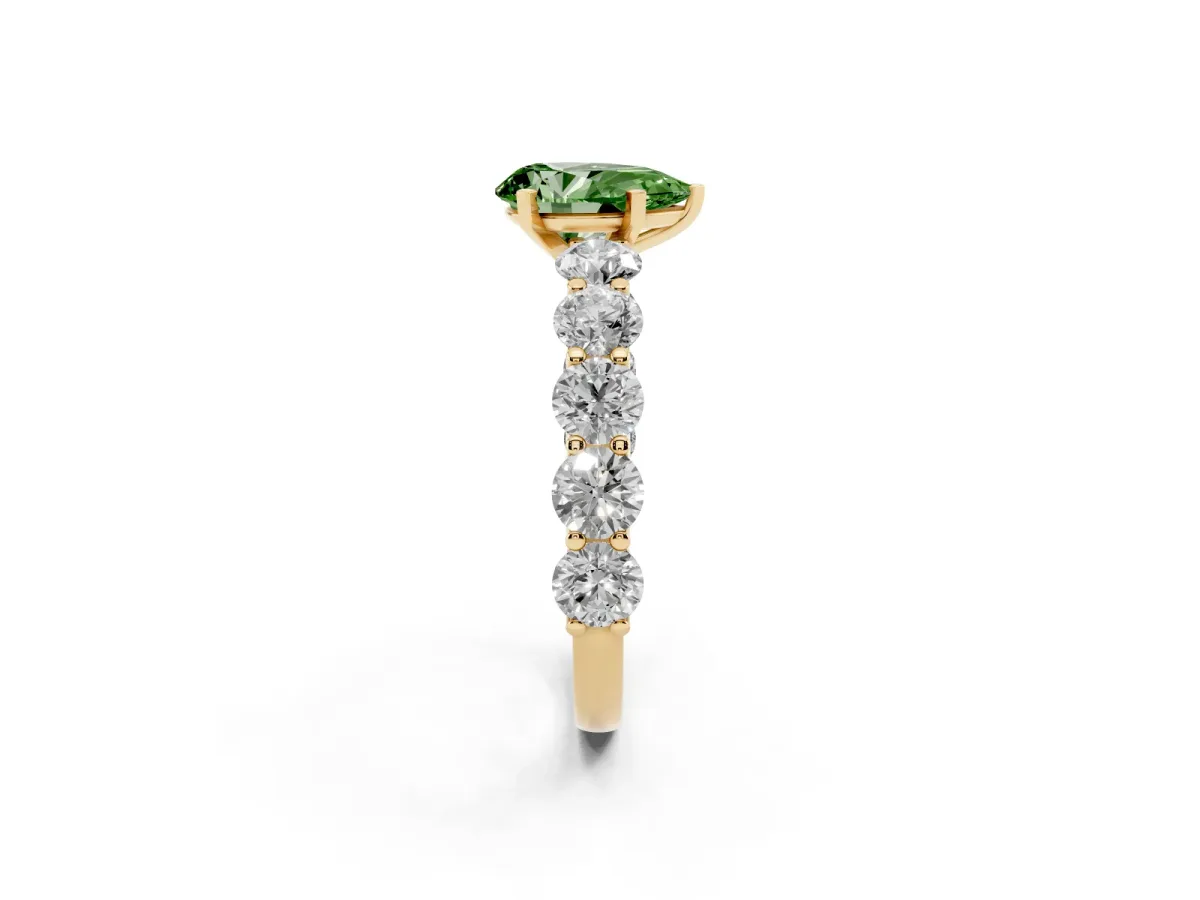 Fancy Green Pear Cut Diamond Prong Setting with Side Stones on a Pave Band Yellow gold