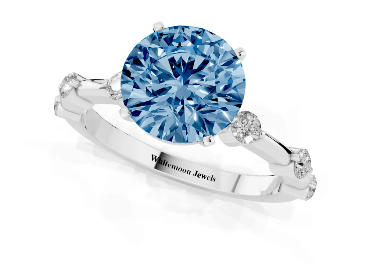 Fancy Blue Round Cut Solitaire Diamond Ring with Bezel Set Side Stones and Prong Setting Silver