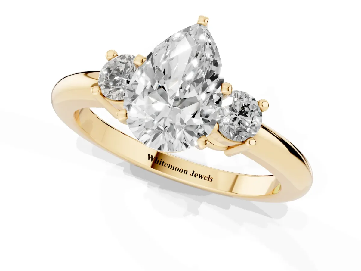 Three-Stone Pear Cut Cut Diamond Solitaire with Prong Setting and Classic Band Yellow gold