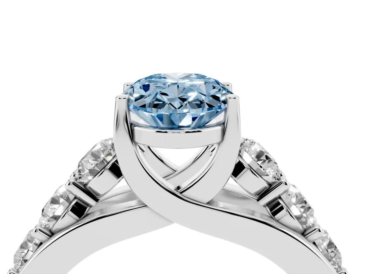 Fancy Blue Oval Cut Diamond Engagement Ring with Pavé Band and Four-Prong Setting Silver
