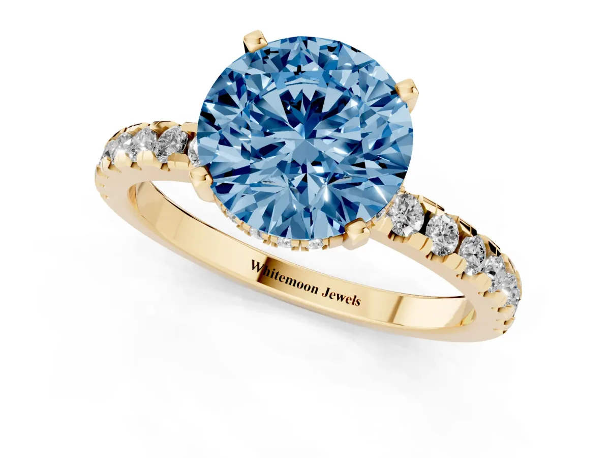 Fancy Blue Round Cut Diamond Solitaire Ring with Round Pavé Band and Four-Prong Setting Yellow gold