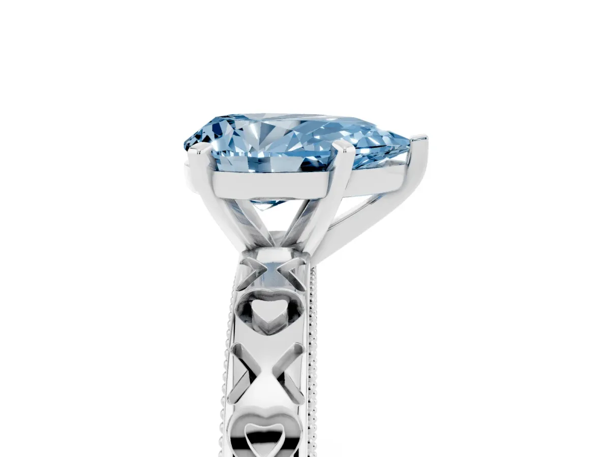 Fancy Blue Pear Cut Solitaire Diamond Engagement Ring with XO Engraved Band and Four-Prong Setting White gold