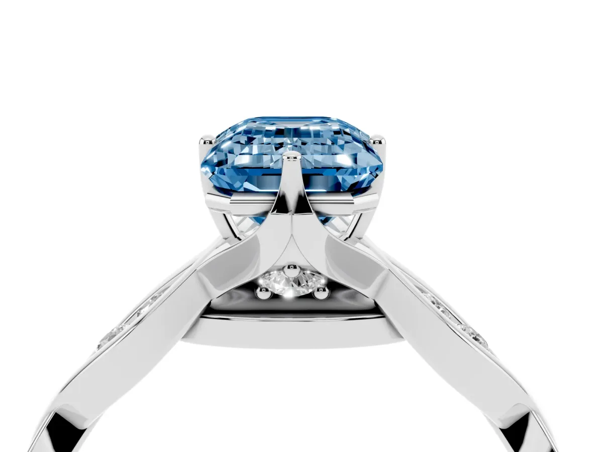 Fancy Blue Emerald Cut Solitaire Twist Band with Leaf Prong Setting Platinum