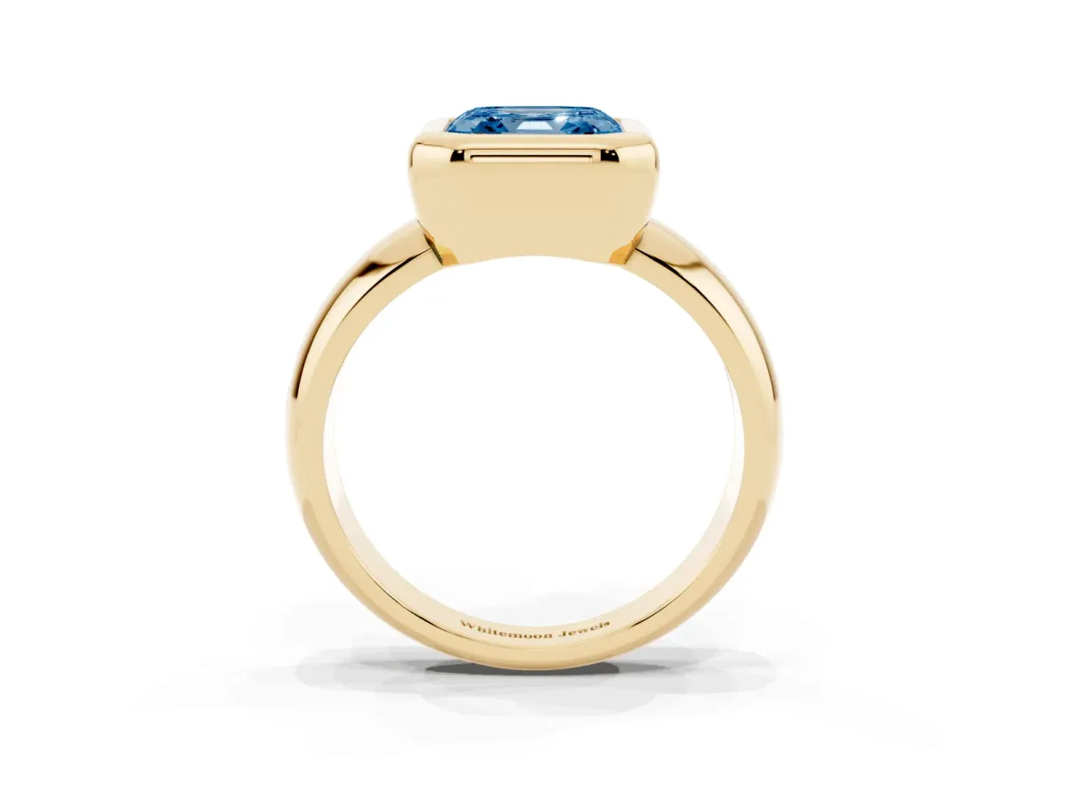 Fancy Blue Bezel Set Asscher Cut Solitaire Ring with Wide Band Yellow gold