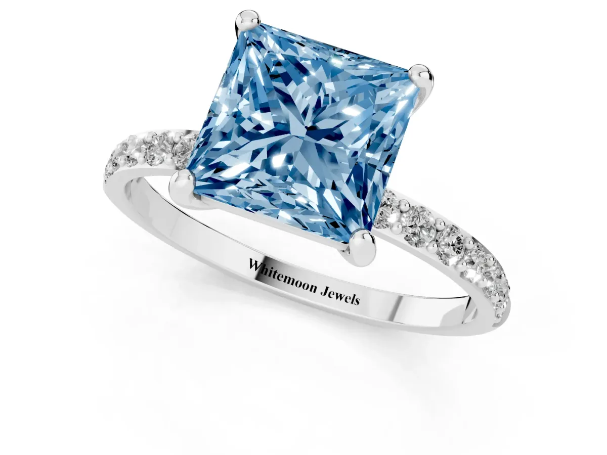 Fancy Blue Princess Cut Diamond Solitaire Ring with Round Pavé Band and Prong Setting Silver