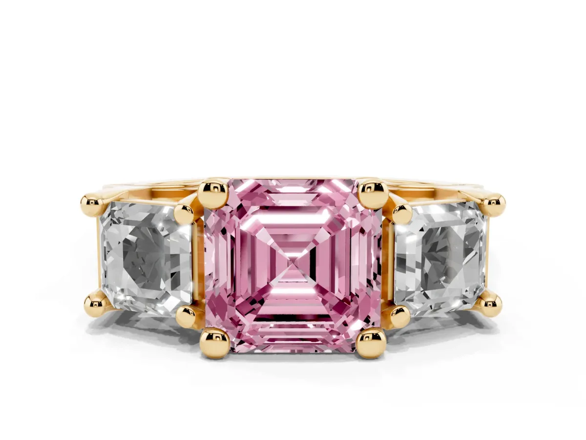Fancy Pink Asscher Cut Diamond Three-Stone Ring with Channel Set Band and Four-Prong Setting Yellow gold