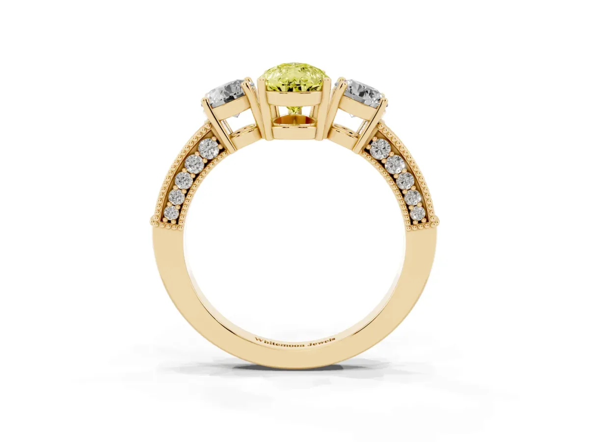 Fancy Yellow Pear Cut Three-Stone Diamond Ring with Pavé Band and Four-Prong Setting Yellow gold