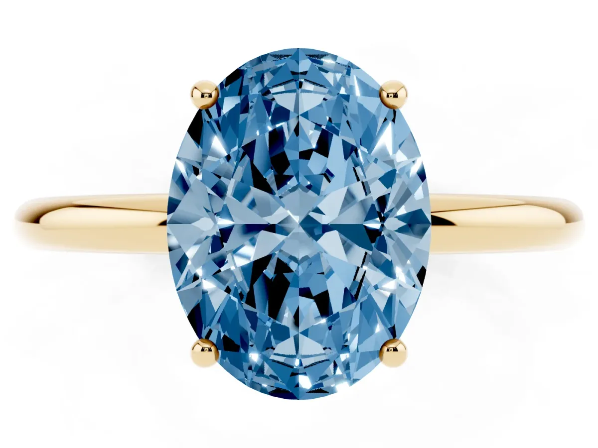 Fancy Blue Oval Cut Solitaire Diamond Ring with a Classic Band and Four-Prong Setting Yellow gold