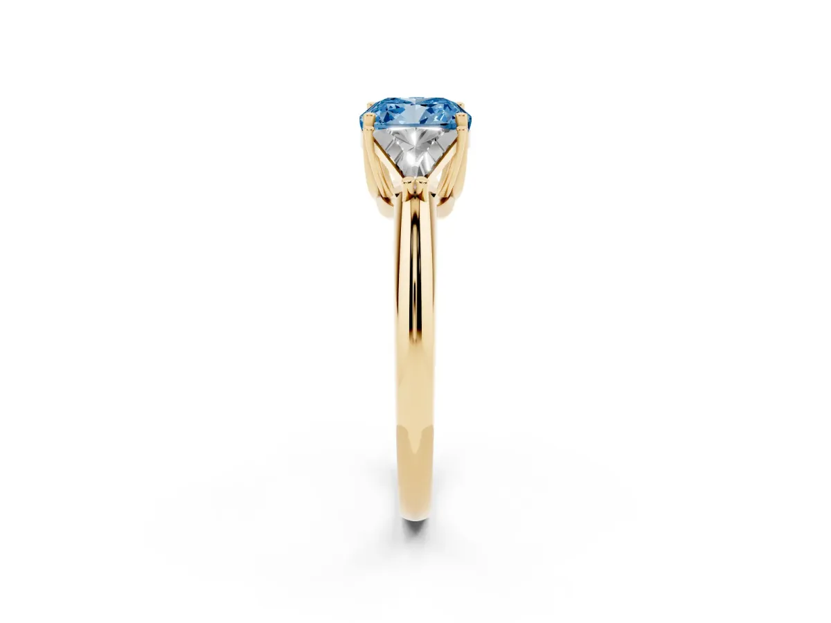 Fancy Blue Three-Stone Cushion Cut Diamond Engagement Ring with Trillion Side Stones and Prong Setting Yellow gold