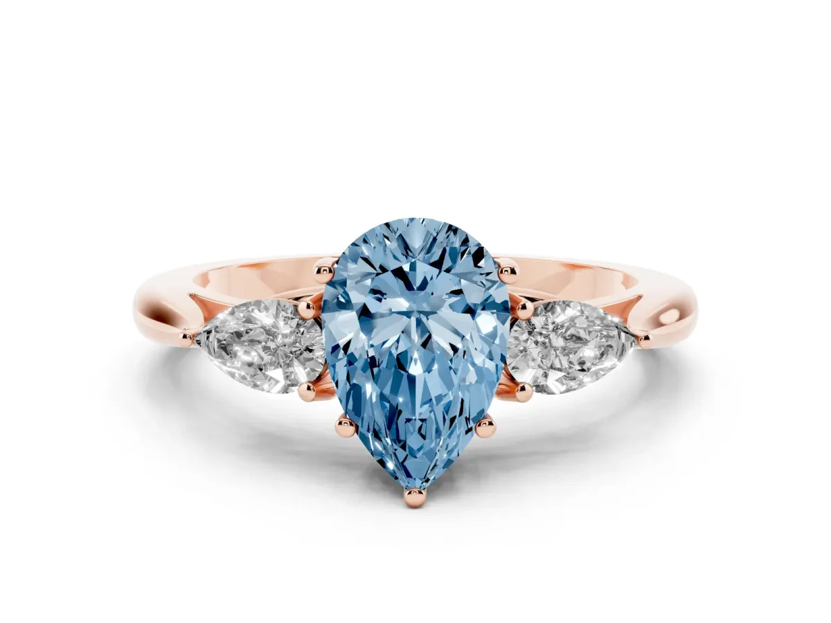 Fancy Blue Three-Stone Pear Cut Diamond Ring with Pear Side Stones in Four-Prong Setting Rose gold