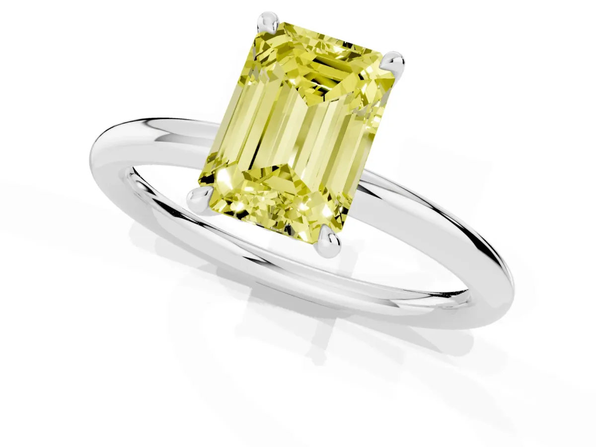 Fancy Yellow Emerald Cut Diamond Solitaire Ring with Thin Band and Four-Prong Setting Silver