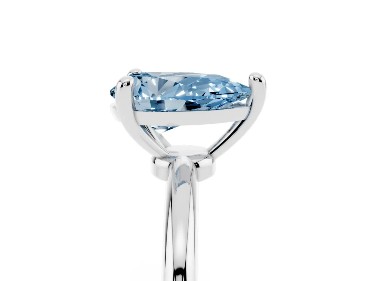 Fancy Blue Pear Cut Solitaire Diamond Ring with 4-Prong Setting on a Classic Band Silver