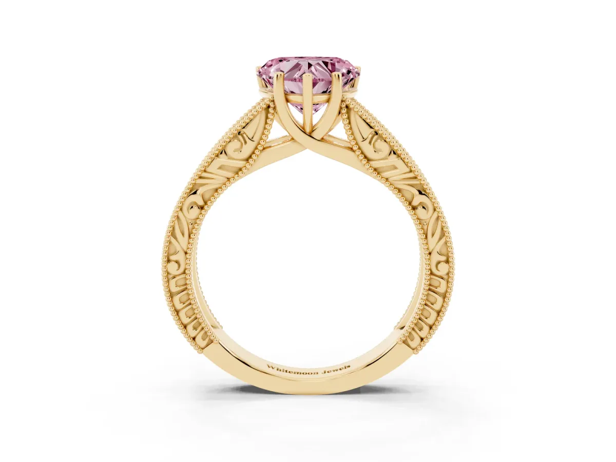 Fancy Pink Heart Cut Diamond Solitaire Ring with Engraved Band and Four-Prong Setting Yellow gold
