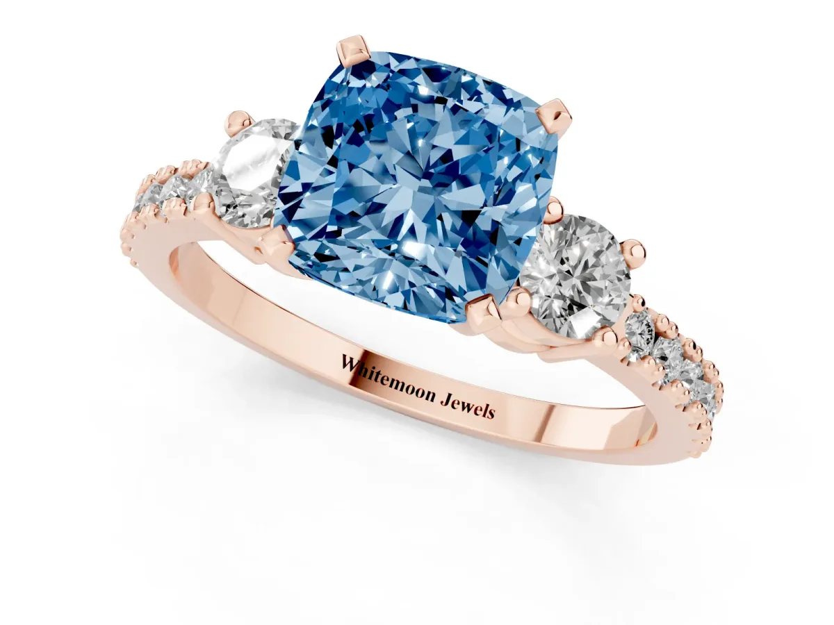 Fancy Blue Cushion Cut Three-Stone Diamond Pavé Band with Prong Setting Rose gold