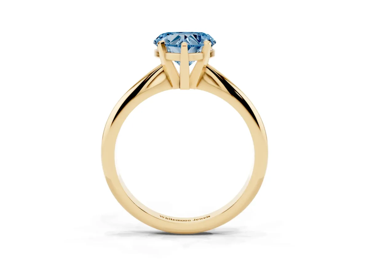 Fancy Blue Heart Cut Cut Solitaire Ring with Four-Prong Setting on a Classic Band Yellow gold