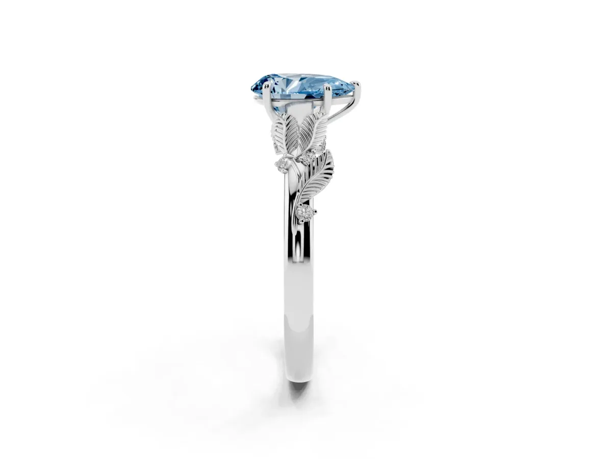 Fancy Blue Pear Cut Diamond Solitaire Ring with Leaf Motif Band and Four-Prong Setting Silver