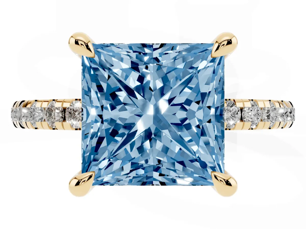 Fancy Blue Princess Cut Diamond Brilliant Solitaire Ring with Pavé Band and Four-Prong Setting Yellow gold