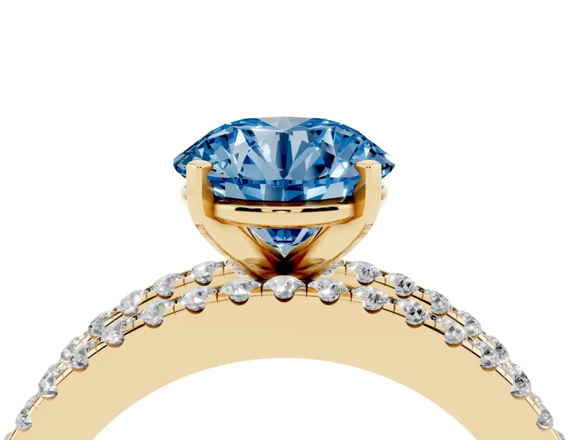 Fancy Blue Round Cut Diamond Solitaire Ring with Pavé and Channel Set Band Yellow gold