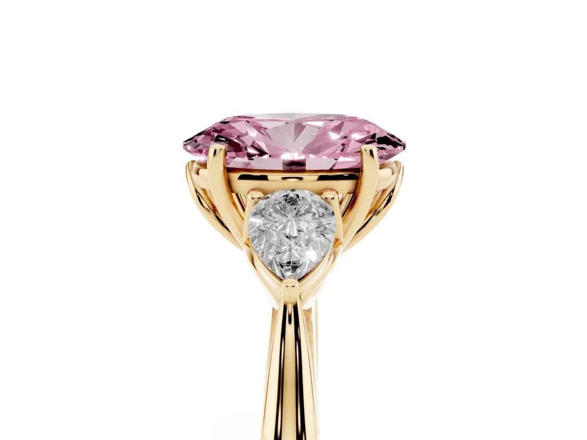 Fancy Pink Three-Stone Oval Cut Brilliant Diamond Solitaire Ring with Tapered Band and Four-Prong Setting Yellow gold
