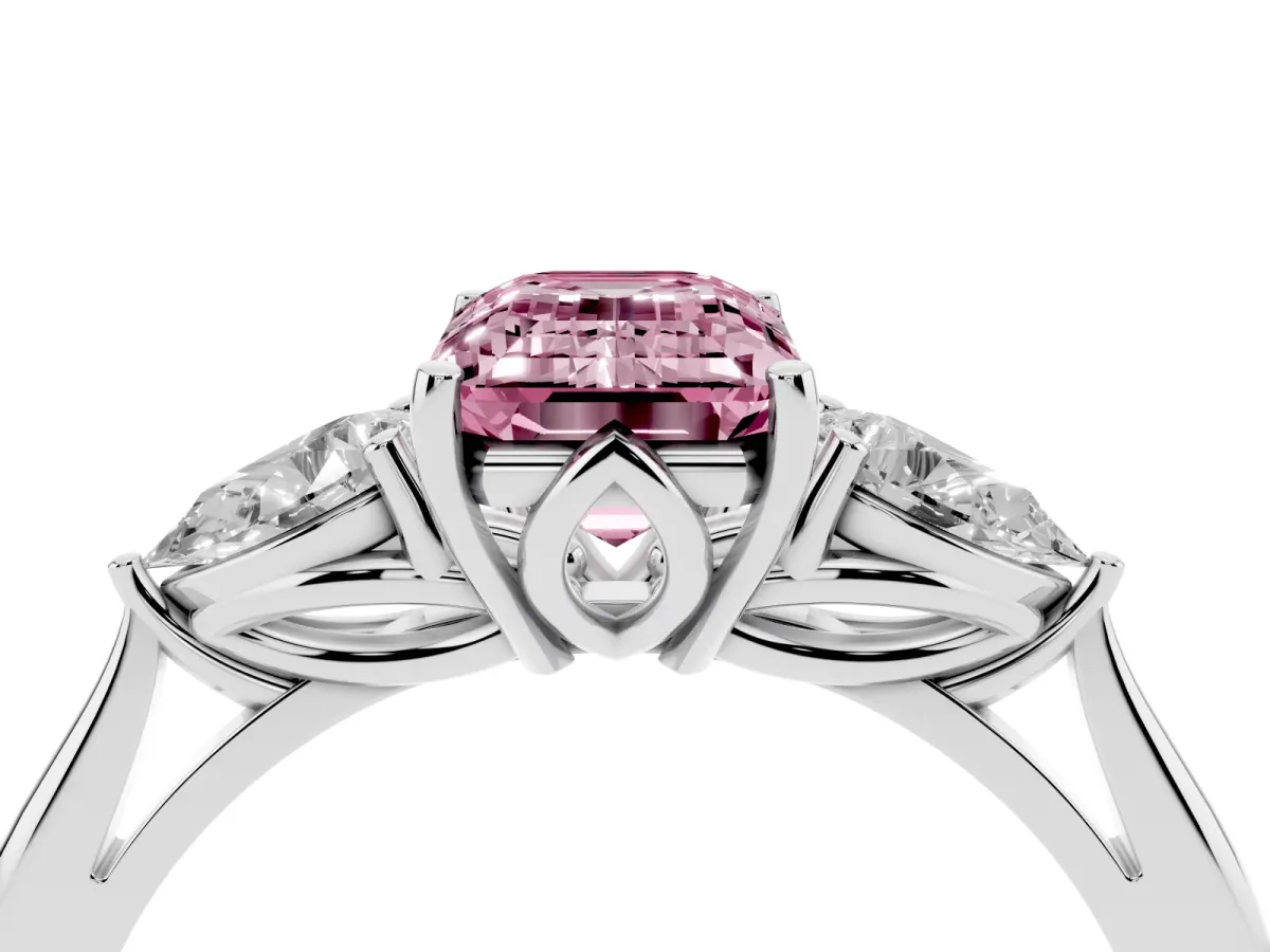 Fancy Pink Three-Stone Emerald Cut Diamond Ring with Pear Side Stones in Four-Prong Setting Platinum