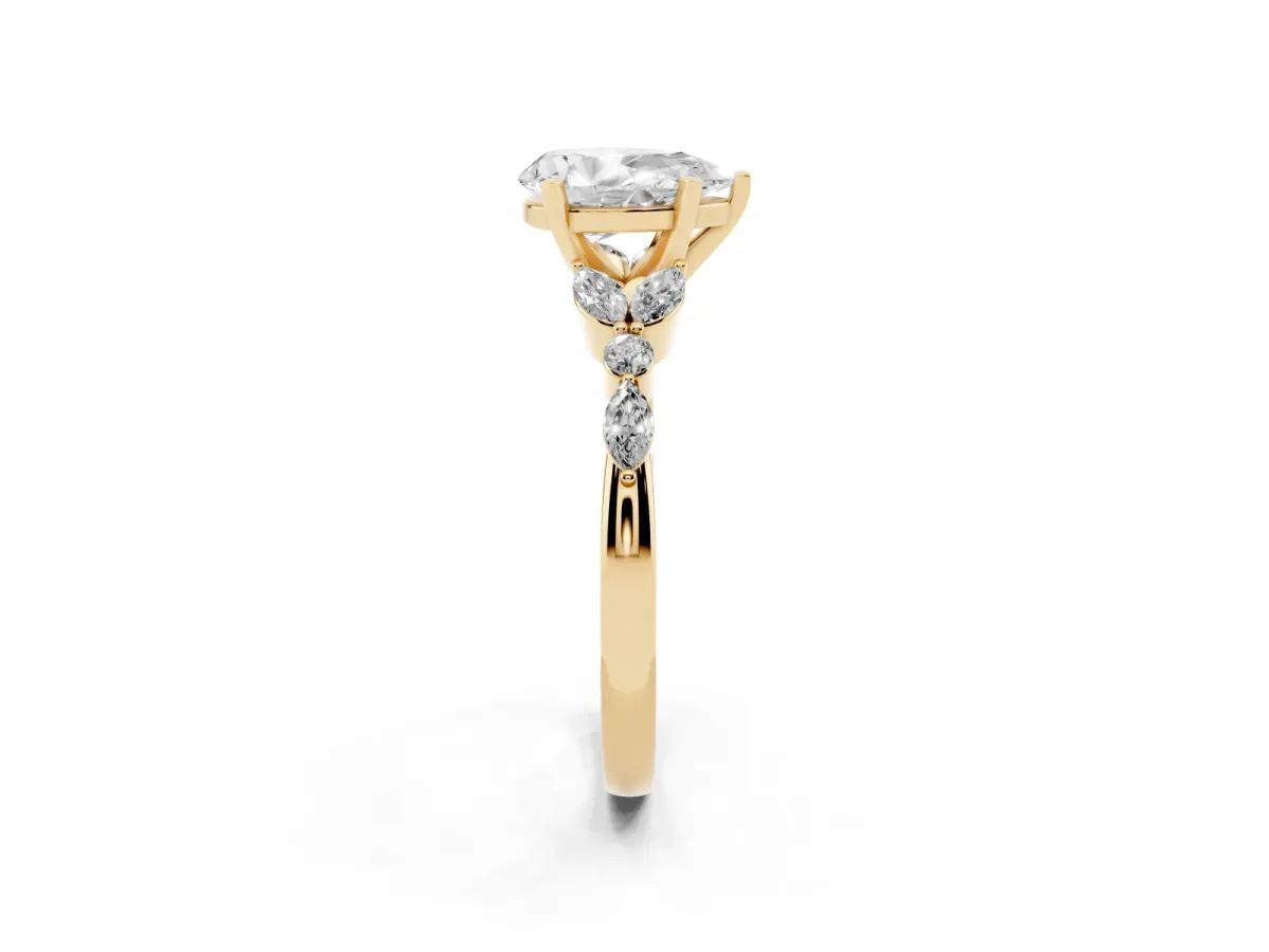 Pear Cut Diamond Solitaire Ring with Side Stones and Four-Prong Setting Yellow gold