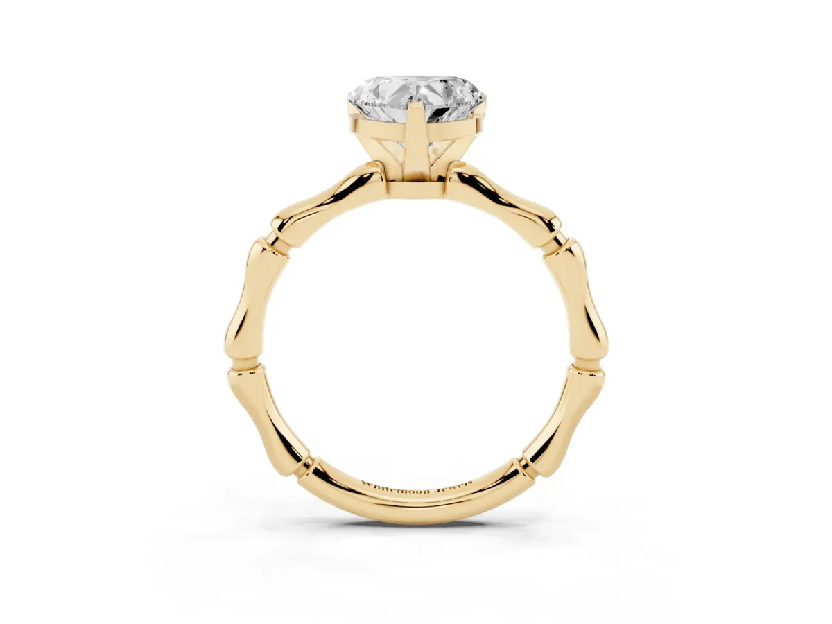 Heart Cut Solitaire Diamond Ring with Bamboo Band and Four-Prong Setting Yellow gold