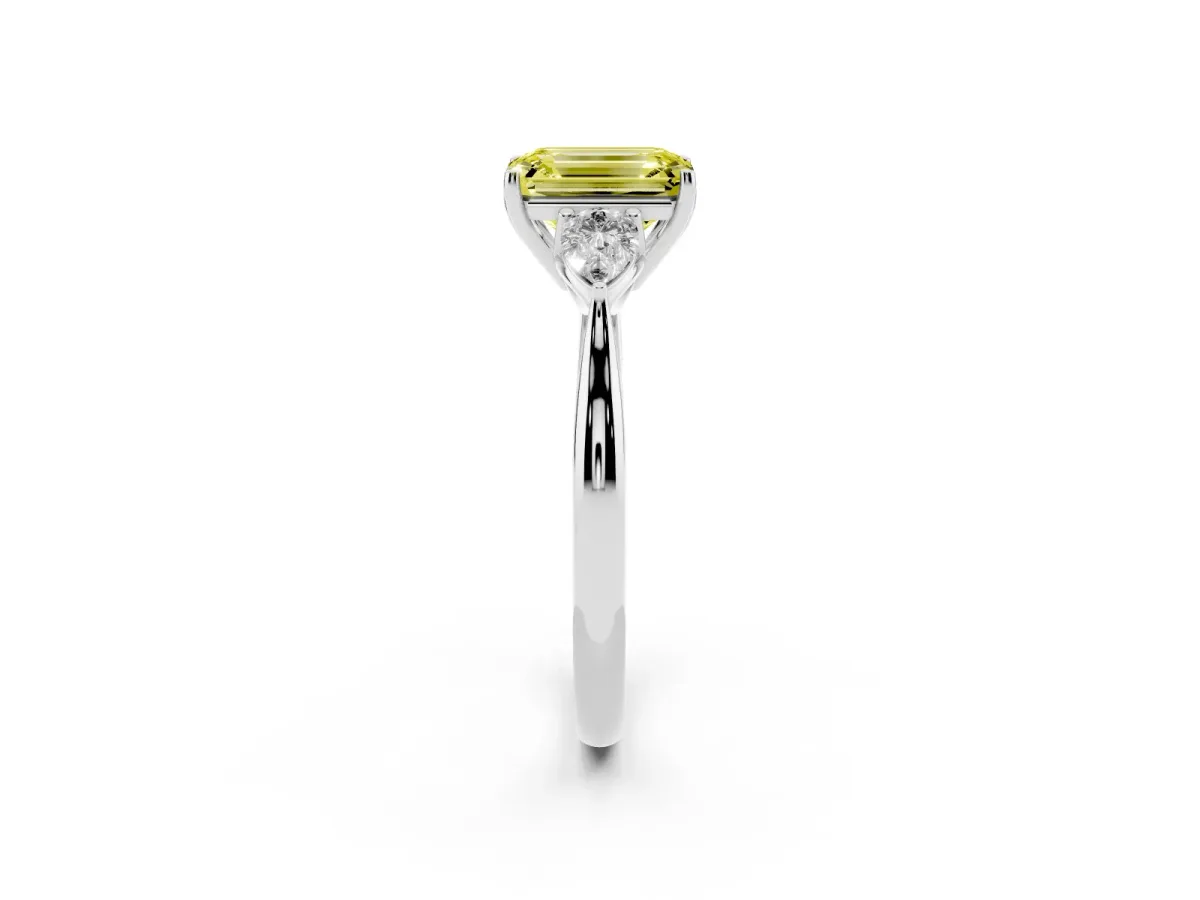 Fancy Yellow Three-Stone Emerald Cut Brilliant Diamond Solitaire Ring with Tapered Band and Four-Prong Setting Platinum
